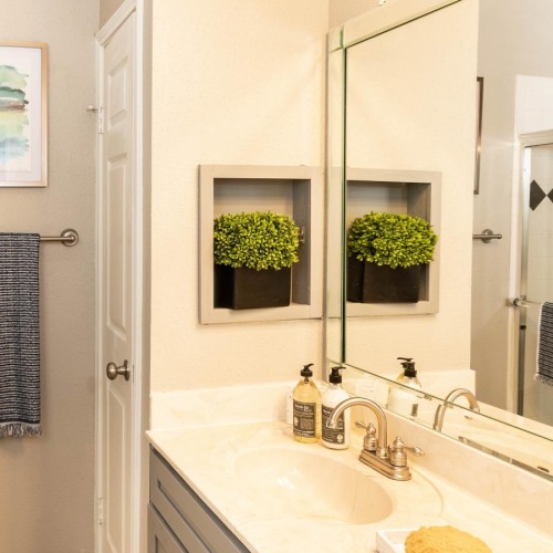 a bathroom with a large mirror