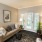 a living room with a couch and a mirror