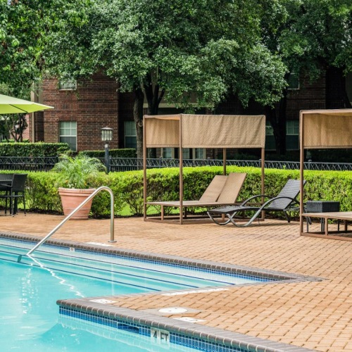 a pool with chairs around it